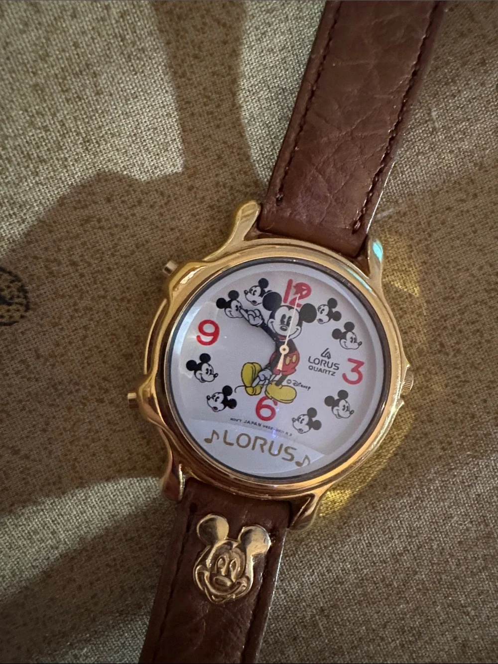 Needs batteries: Disney Lorus Gold-Tone Mickey Mouse Watch with Brown Strap